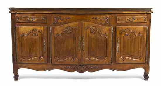 A Louis XV Provinicial Style Walnut Server having a serpentine