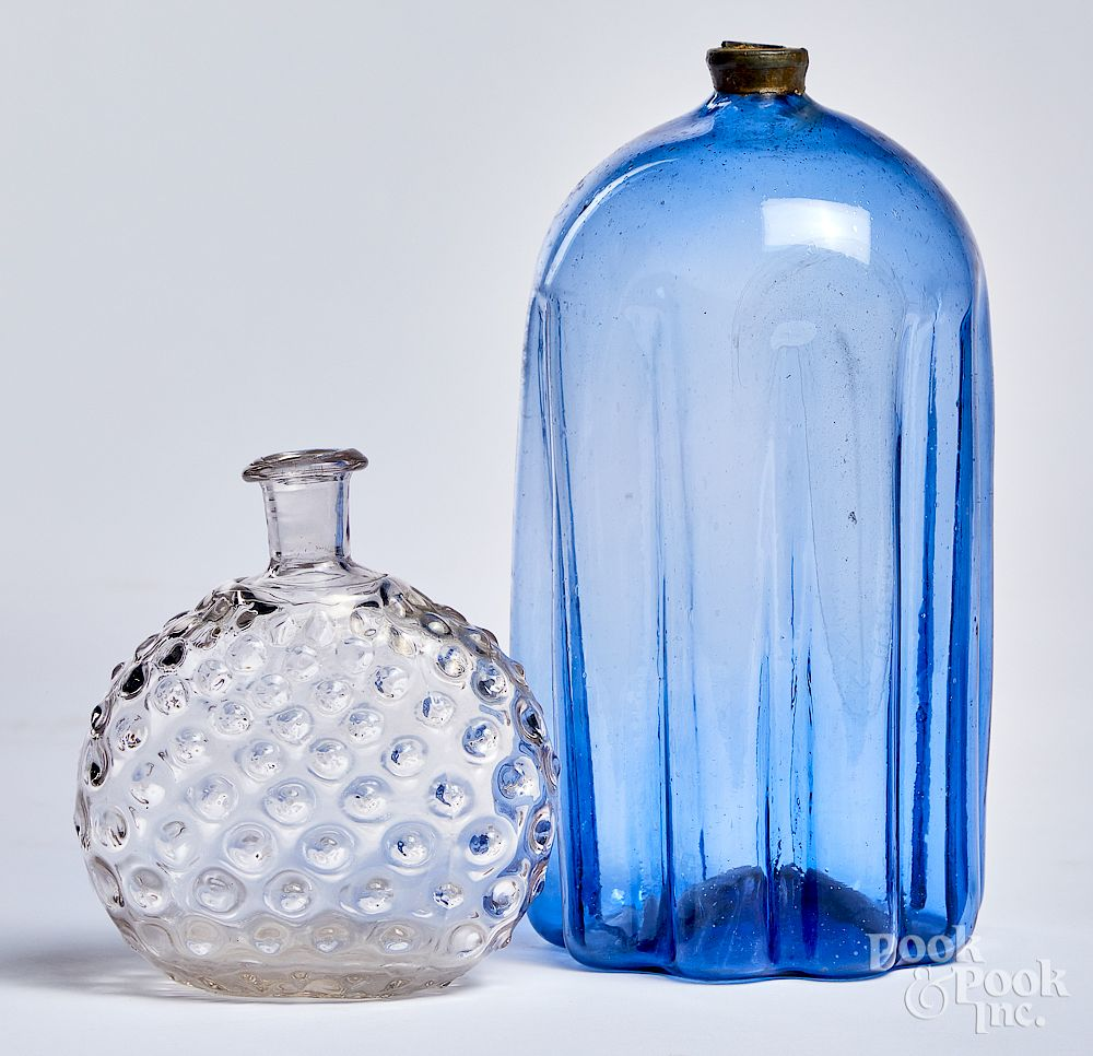 Pale purple blue glass bottle and colorless flask Pale purple