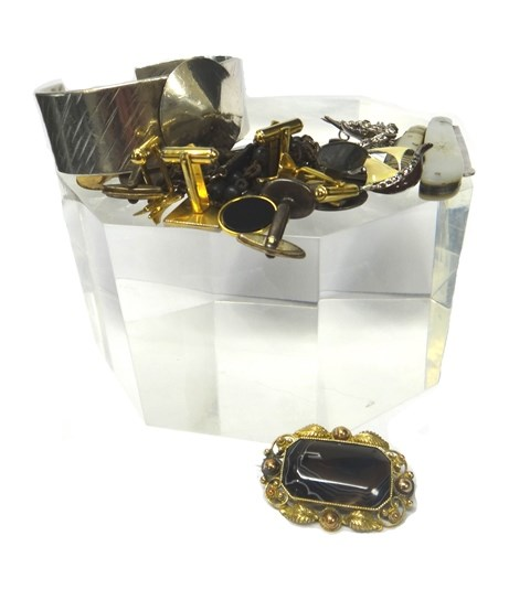 A silver wide bangle with a disc motif weight 97