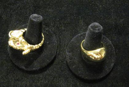 Two 14 karat yellow gold ringsOne elephant form both hollow