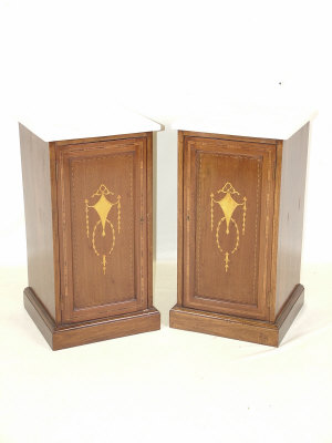 A pair of Edwardian mahogany pot cupboards the square variegated