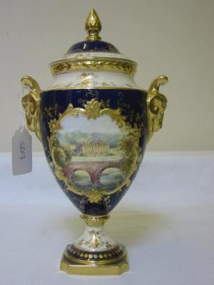 A COALPORT PORCELAIN LIDDED VASE of ovoid form the domed