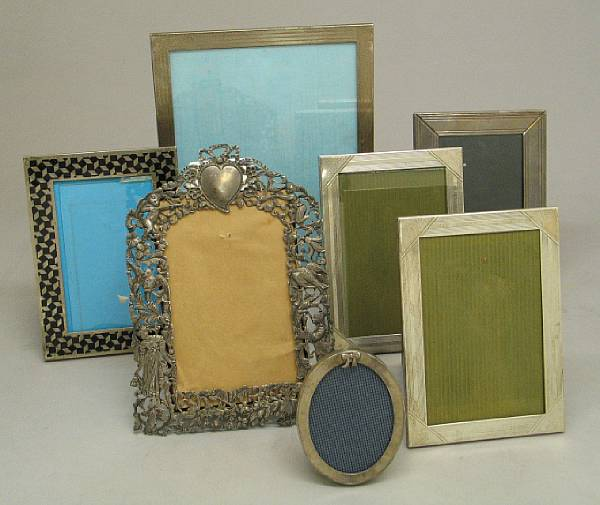 A collection of twelve silver faced photo frames Comprising 1