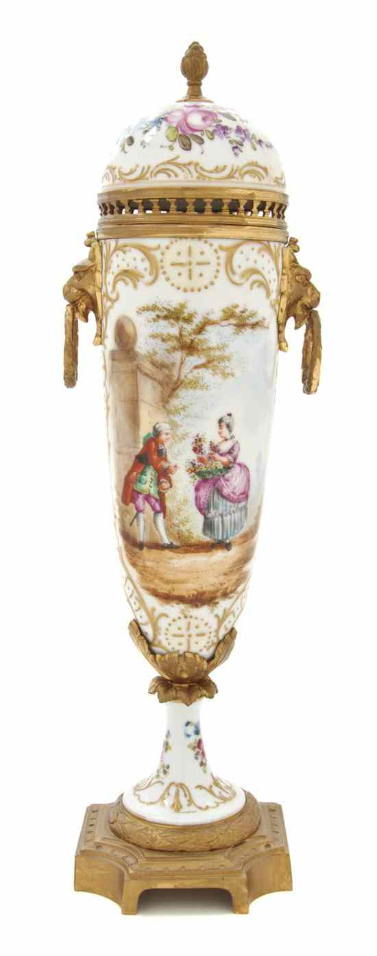 A Continental Porcelain and Gilt Metal Mounted Urn having a