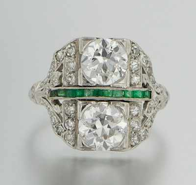 An Art Deco Platinum Diamond and Emerald Ring Open platinum