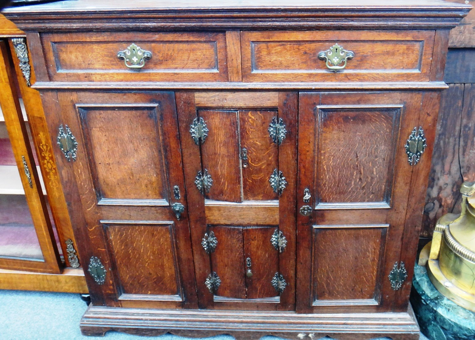 A made up oak side cabinet with a pair of