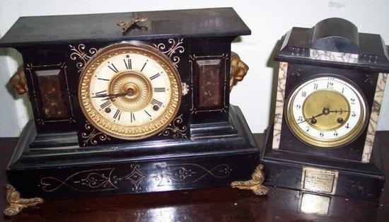 A black slate mantel clock with presentation inscription to the