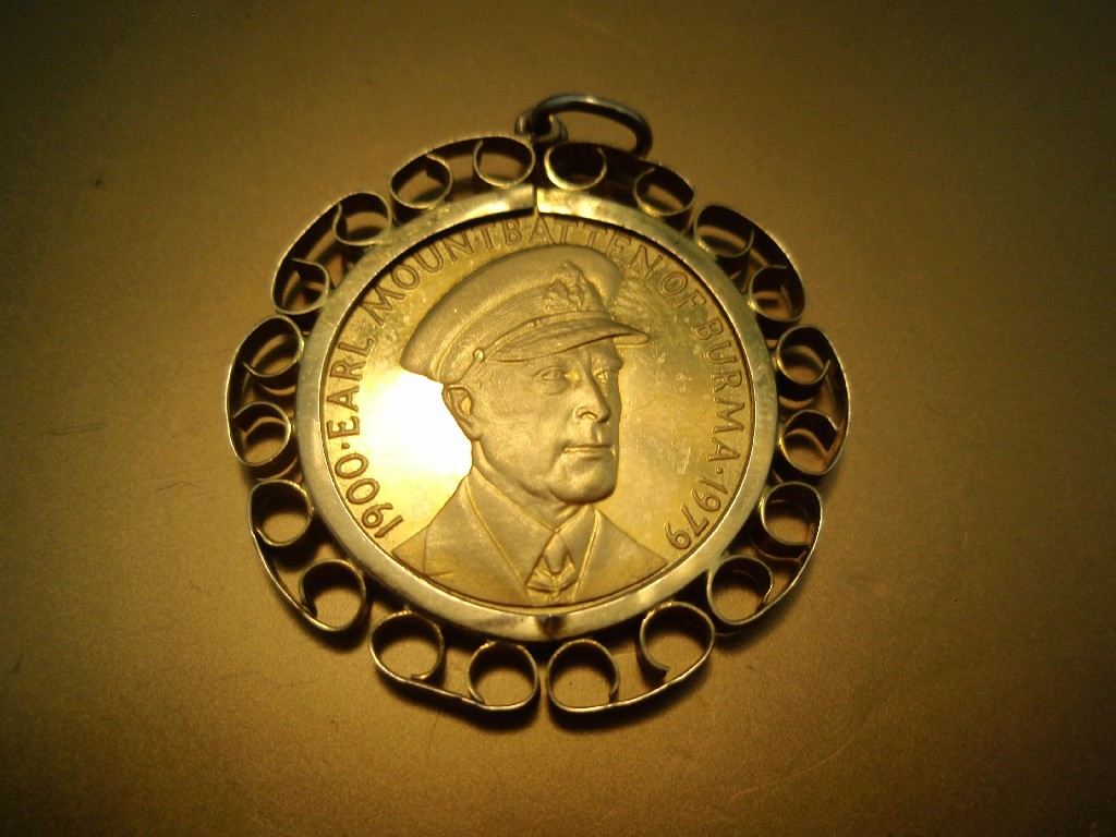 A commemorative coin of Mountbatten with HMS Kelly to the