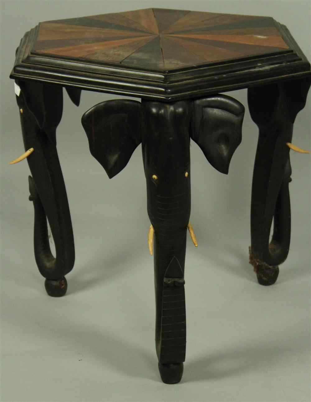 AFRICAN EBONIZED HEXAGONAL SIDE TABLE having a marquetry rayed top