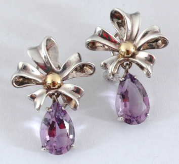 A pair of silver gold and amethyst drop earrings by