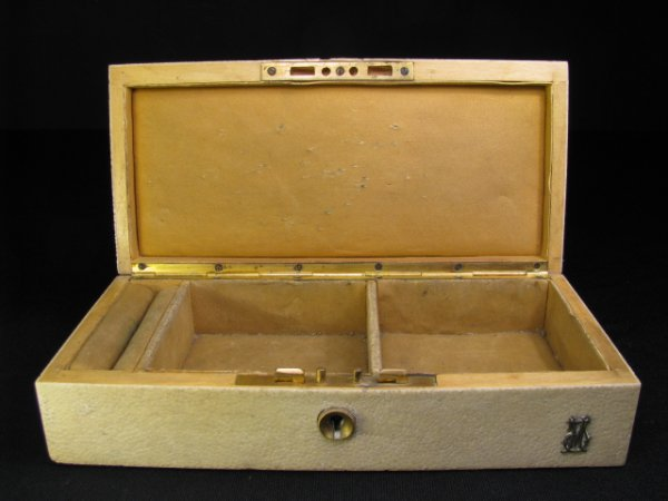Oblong shape suede lined jewelry box covered in white shagreen