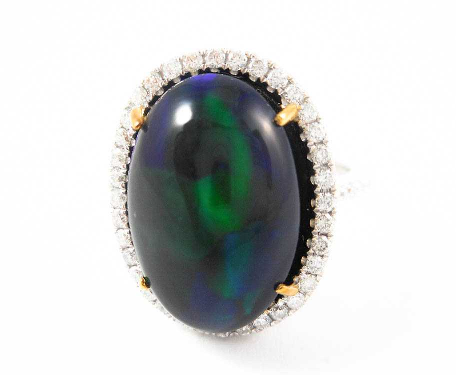 BLACK OPAL DIAMOND AND FOURTEEN KARAT GOLD RING The white