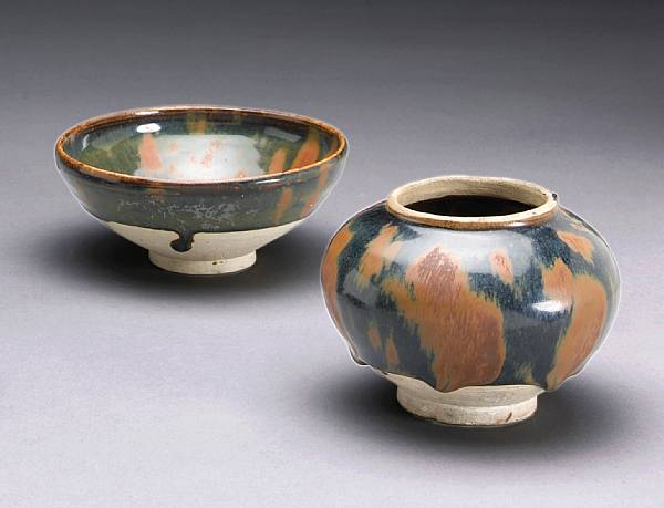 Two black glazed stoneware containers with russet splashed decoration Northern