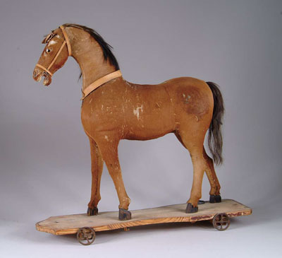 CHILD S RIDE ON PLATFORM HORSE Straw stuffed natural horse