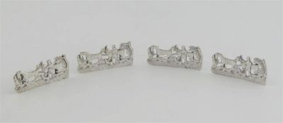 A set of four late Victorian menu holders on a