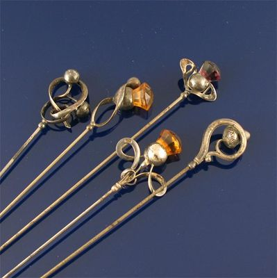 A group of four hat pins by Charles Horner two