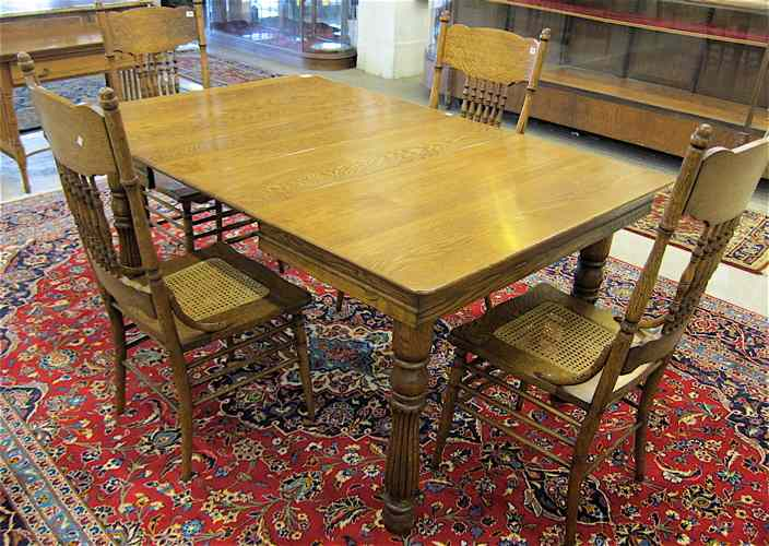 LATE VICTORIAN OAK DINING TABLE AND FOUR CHAIRS American late