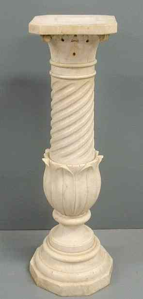 Two part carved marble pedestal with a rotating cut corner