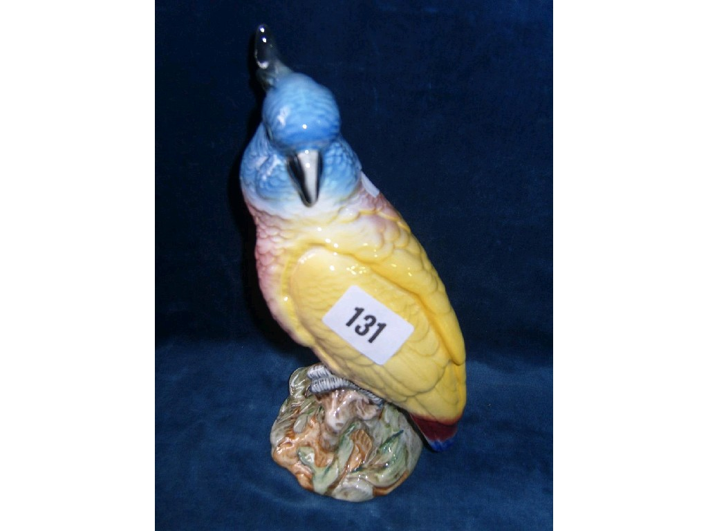 A Beswick model of a cockatoo with impressed number to