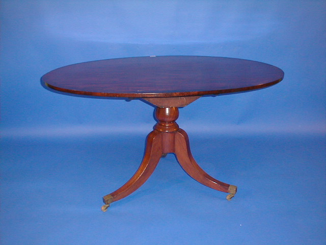 A 19thC mahogany snap top table with cross banded oval