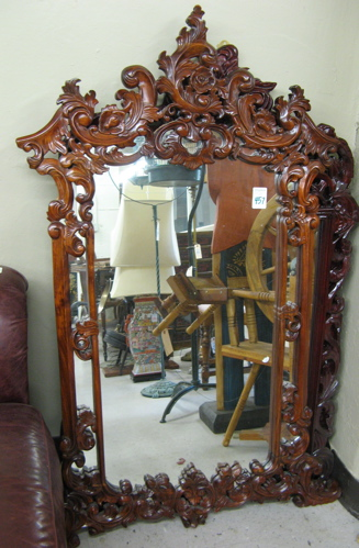 LOUIS XIV STYLE WALL MIRROR having a highly carved mahogany