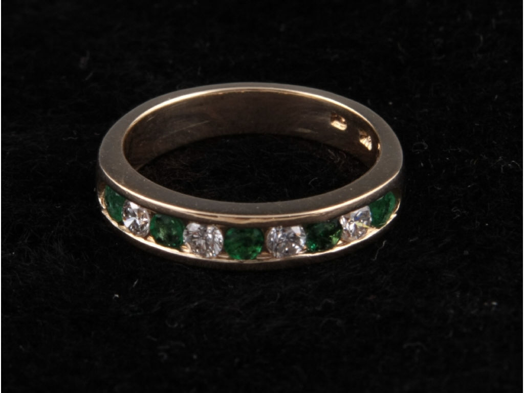 14K Yellow Gold Emerald Diamond Band channel set band containing