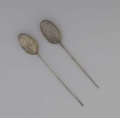 A George II mote spoon with a single drop the