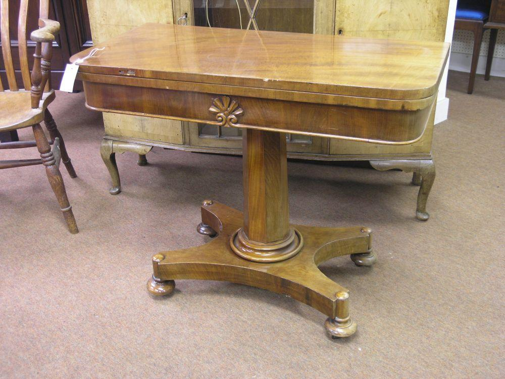 A Victorian mahogany D shaped card table hinged top enclosing