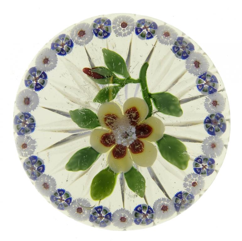 A BACCARAT GARLANDED FLOWER PAPERWEIGHT the yellow and red flower