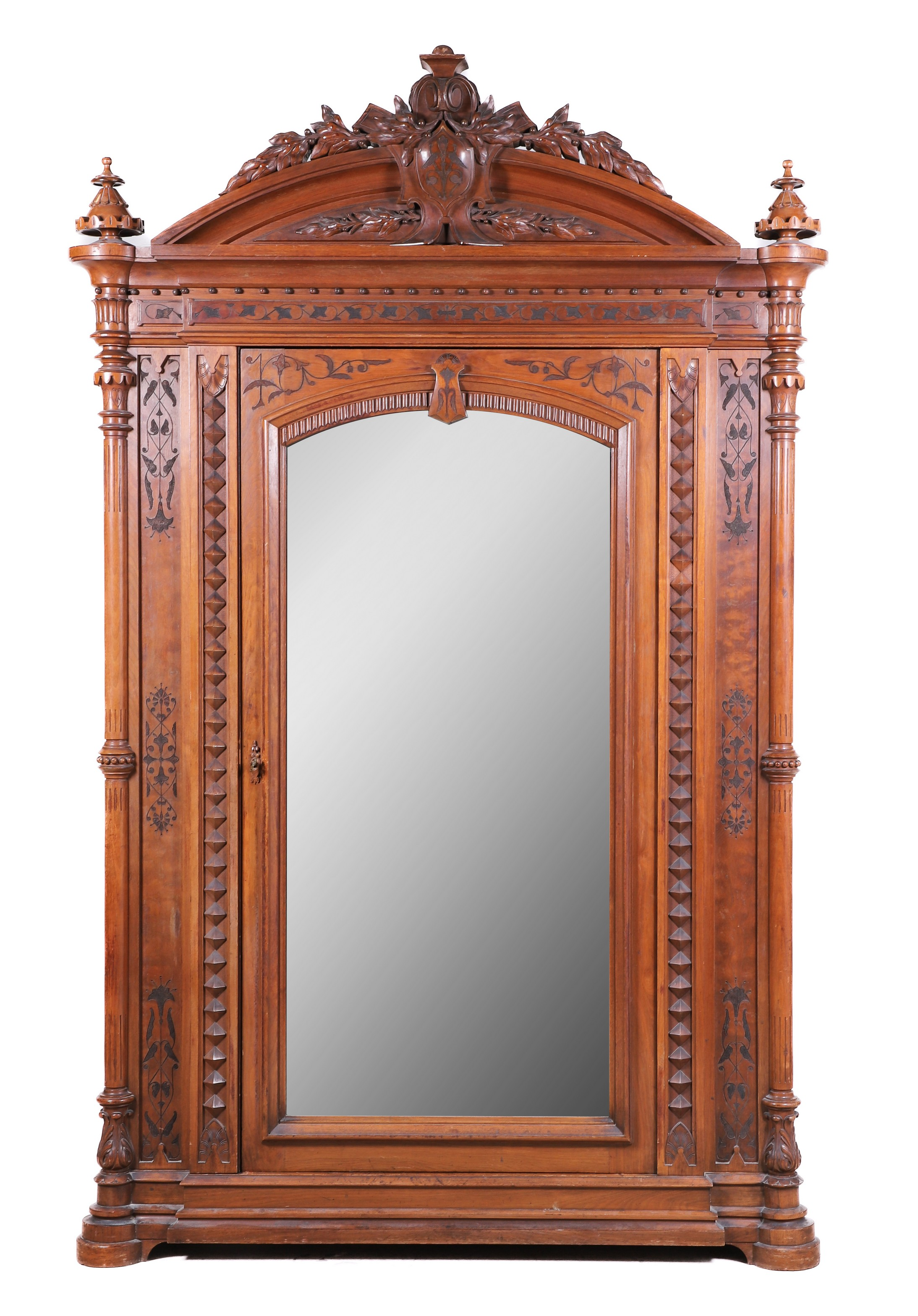 Carved walnut Renaissance Revival Armoire with mirrored door in the