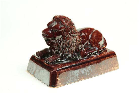 ROCKINGHAM LION East Liverpool Ohio late 19th century yellowware Recumbent