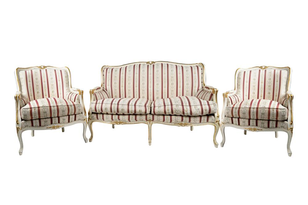 PAINTED PARCEL GILT SALON SETcomprising a settee and a pair