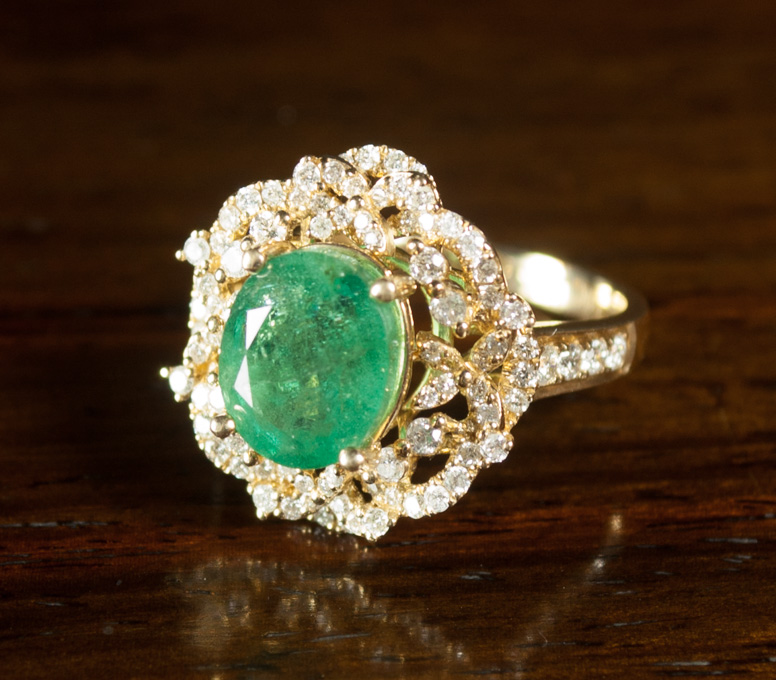 EMERALD DIAMOND AND FOURTEEN KARAT GOLD RING with round cut