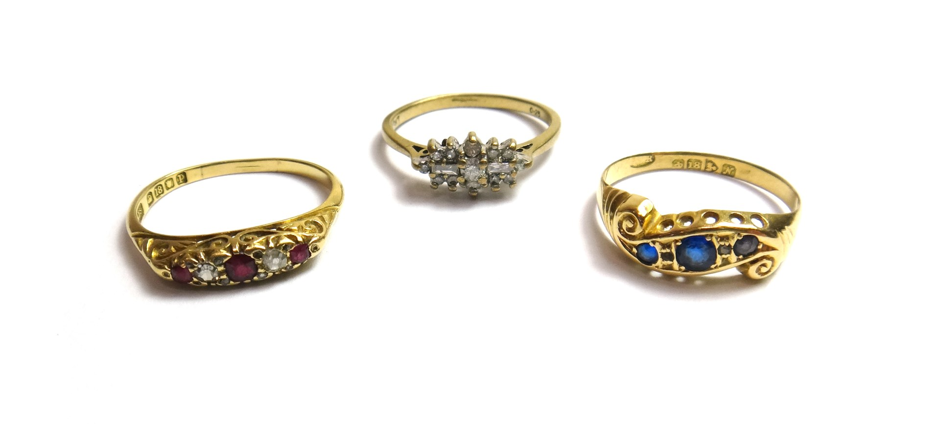 An 18ct gold ruby and diamond set five stone ring