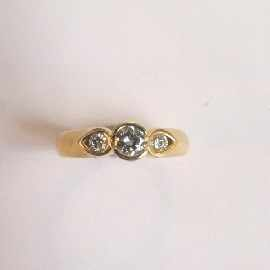 An 18ct gold three stone diamond ring total estimated diamond