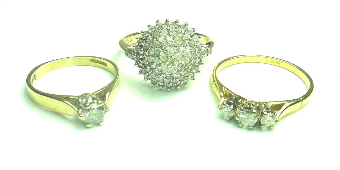 A 9ct gold and diamond set cluster ring an 18ct