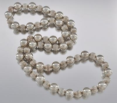 A Sterling Silver Bead Necklace Constructed with 16 mm plain