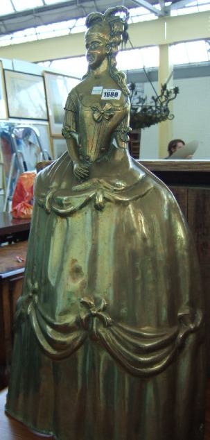 An Edwardian brass fire guard in the form of a