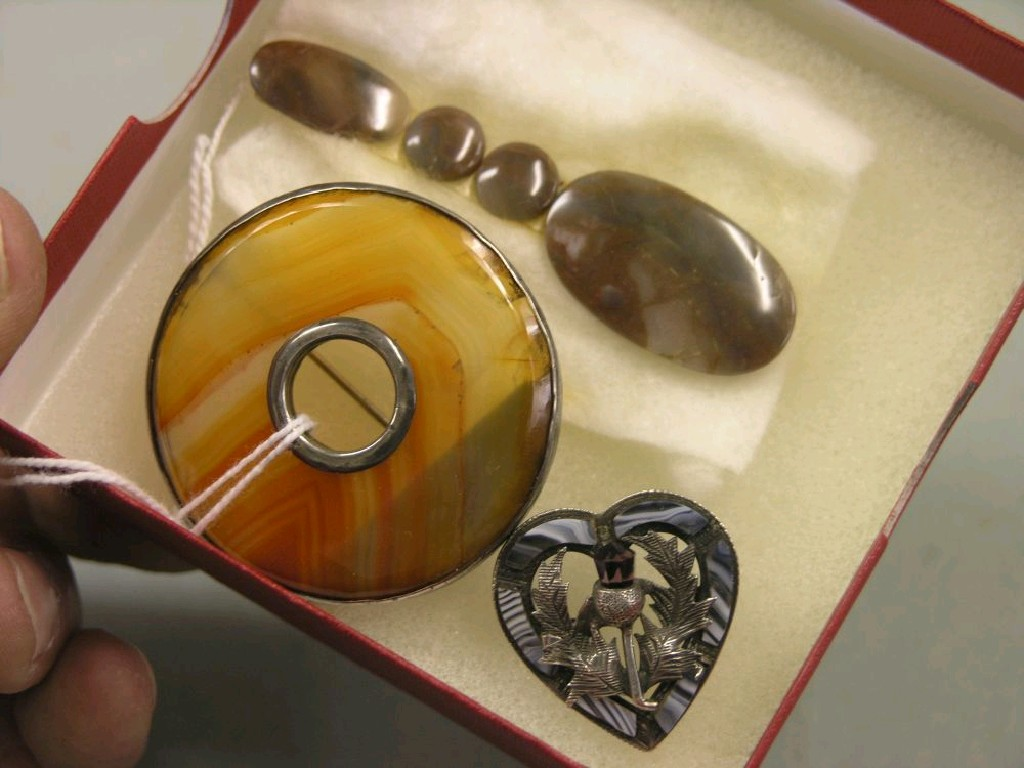 A Scottish gem stone brooch circular form together with a