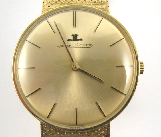 MAN S JAEGER LeCOULTRE WRISTWATCH 18K gold case and integral