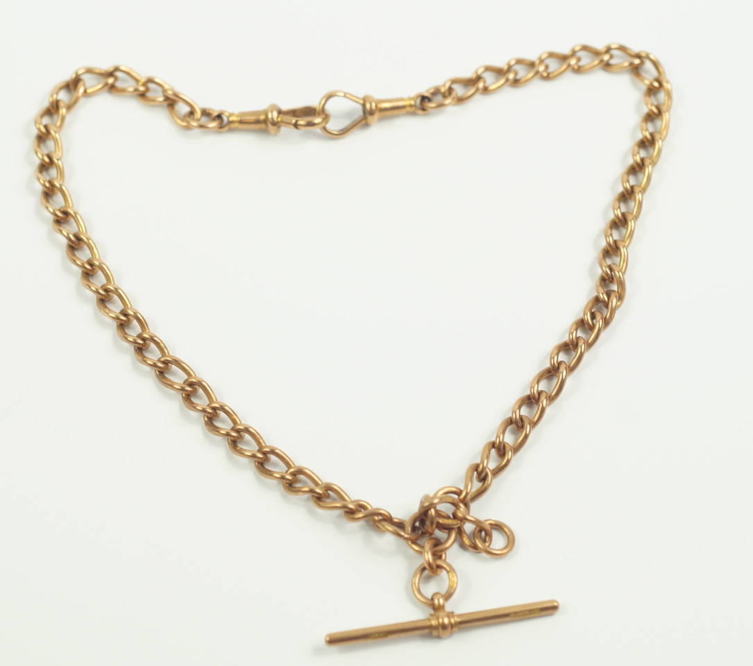 A 9ct rose gold curb link Albert chain with T