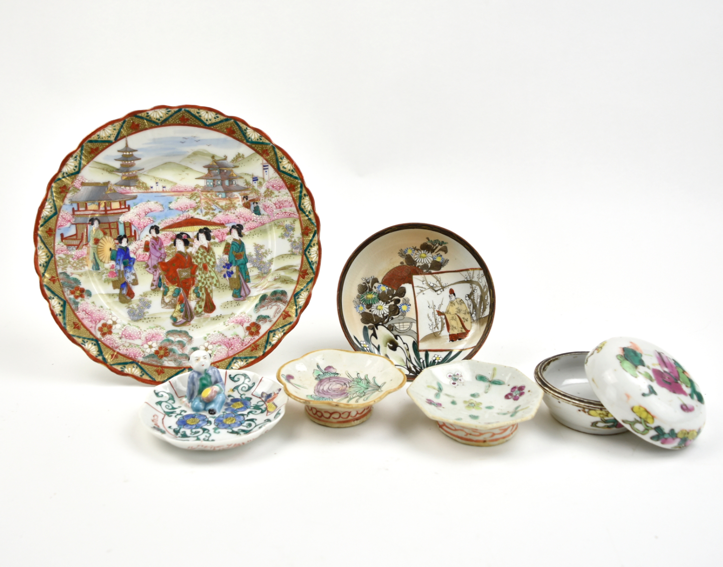 a round box enameled in famille rose palette decorated with