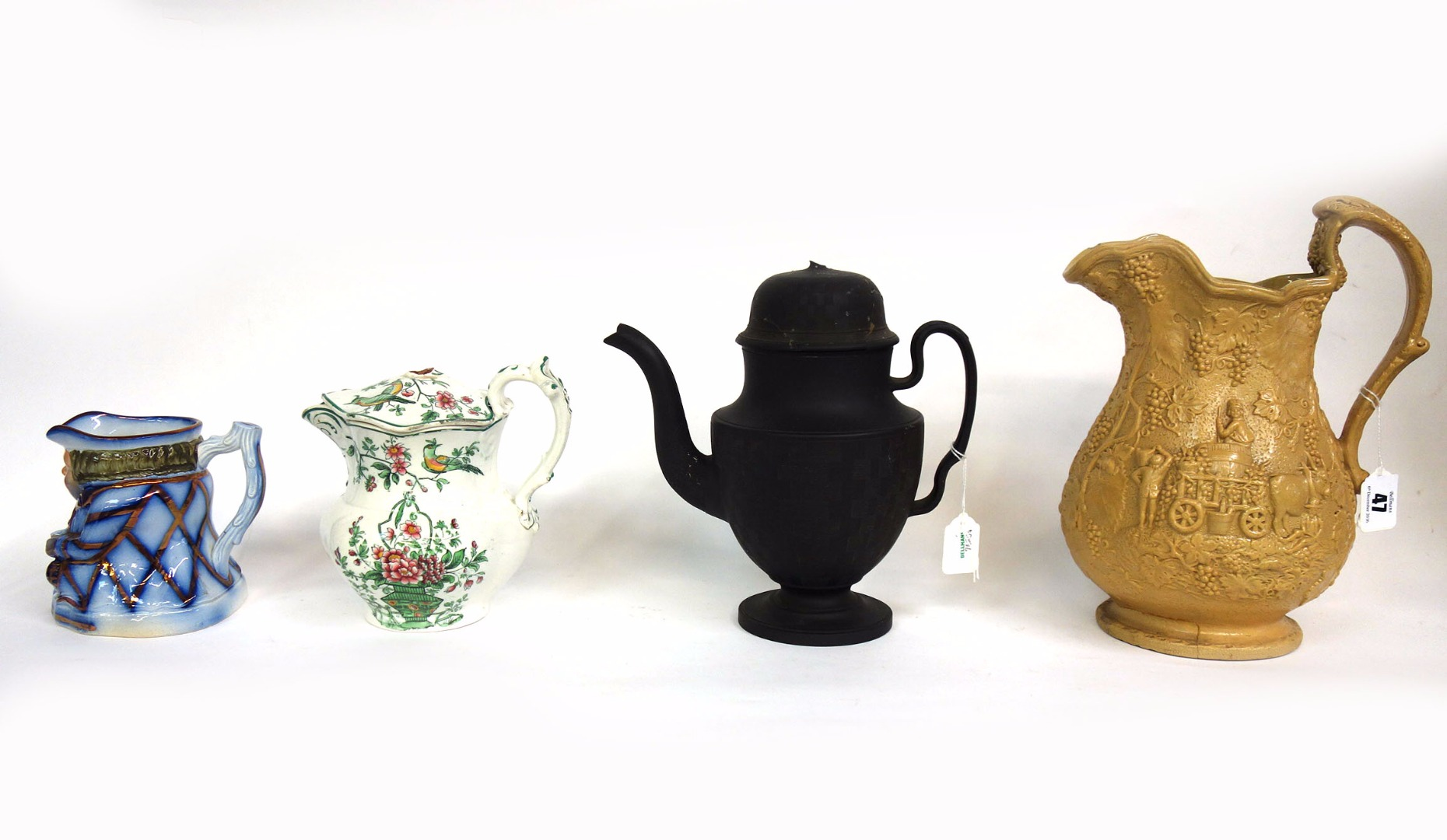 A Victorian salt glaze jug moulded with fruiting vines and