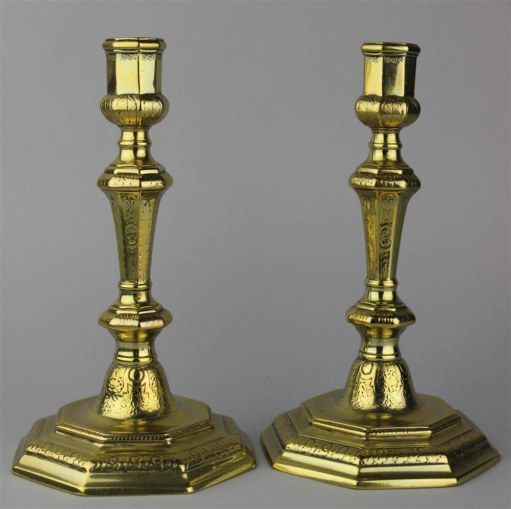 PAIR OF BRASS CANDLESTICKS ON OCTAGONAL BASES perhaps Dutch early