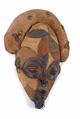 A Chokwe style mask with coloured reeded panel decoration metal