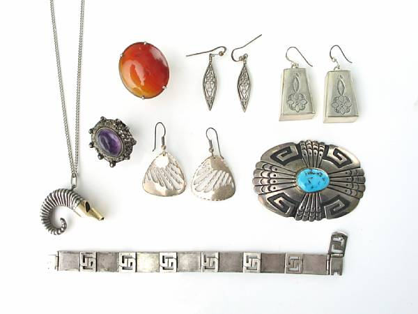 A collection of silver jewelry featuring ten pair of earrings