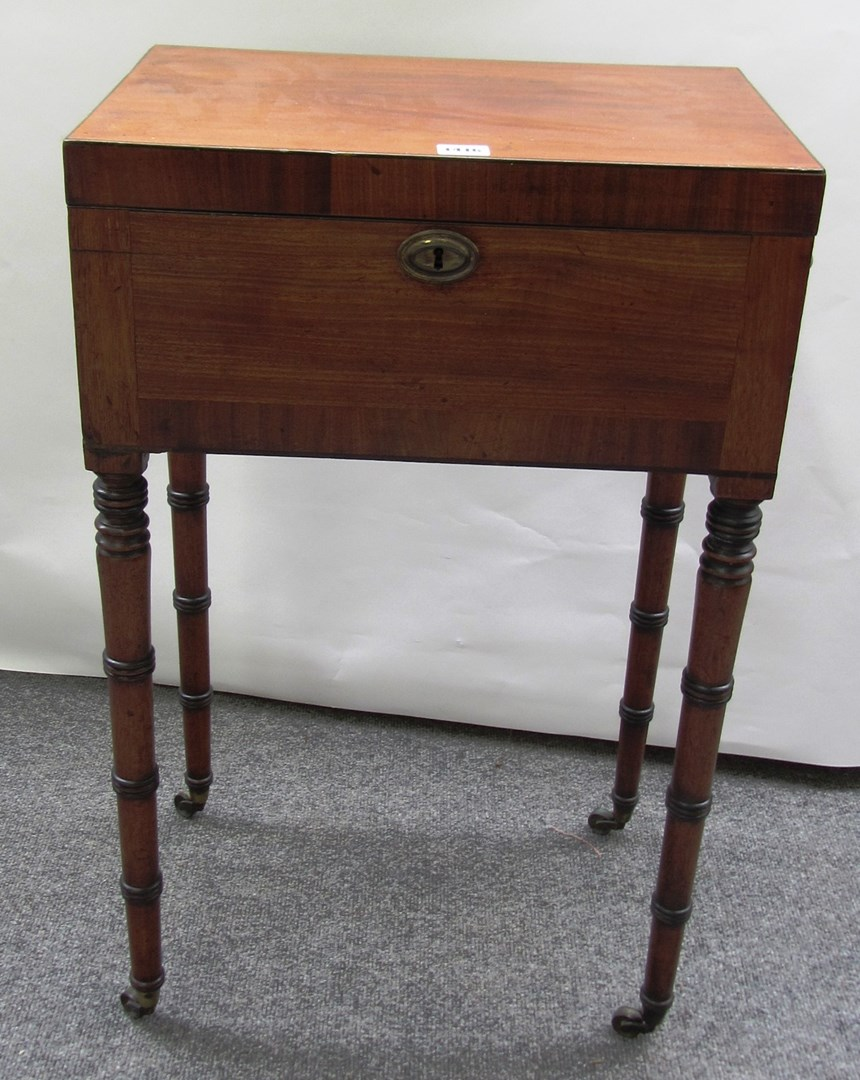 A 19th century rectangular mahogany teapoy with fitted interior on
