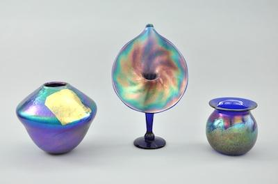A Group of Three Iridescent Art Glass Vases Containing a