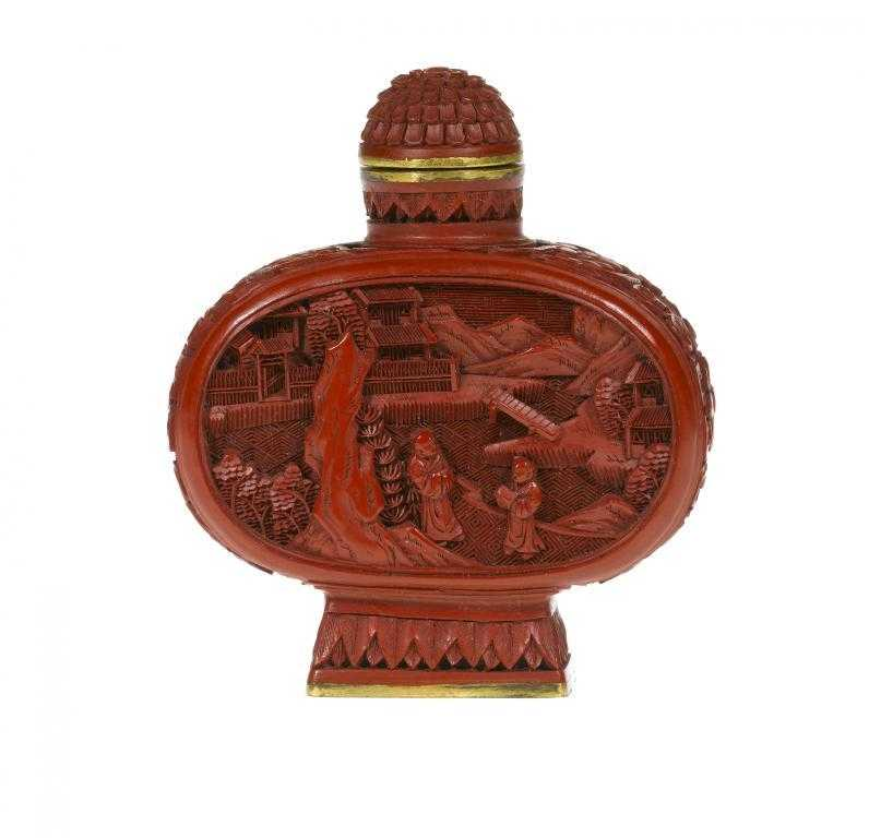 A CHINESE CINNABAR LACQUER SNUFF BOTTLE carved to both faces