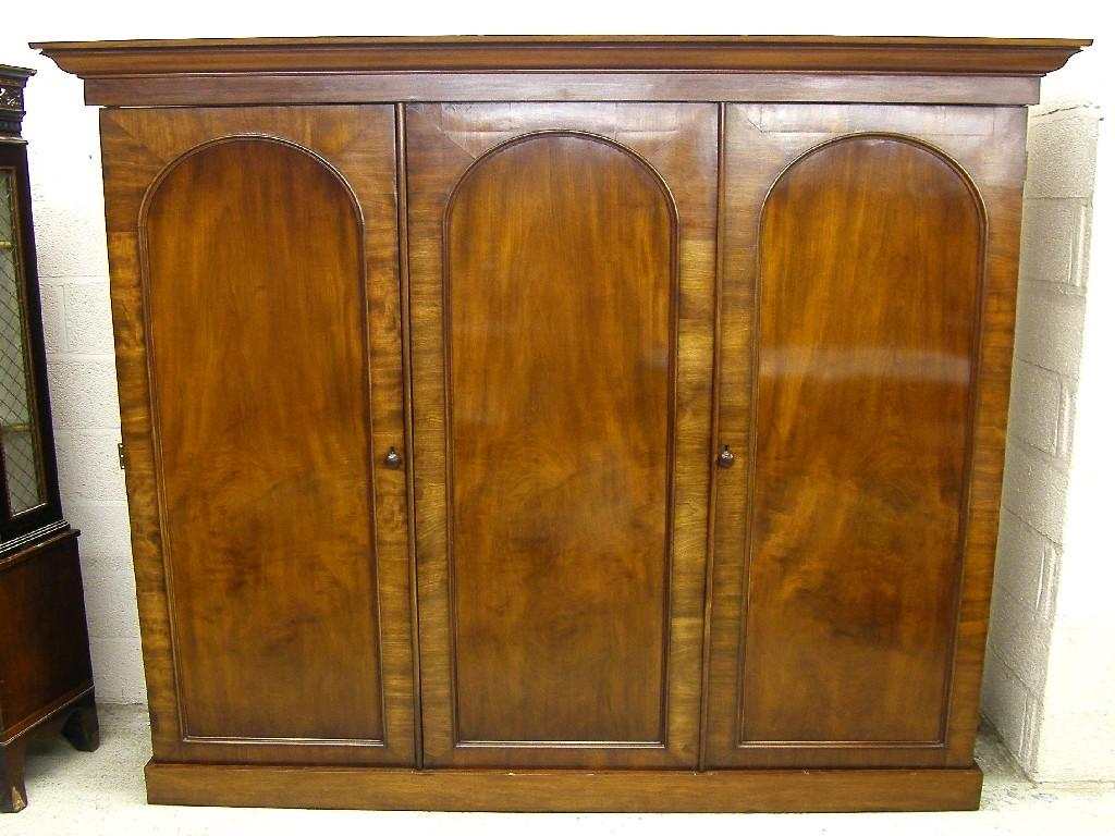 Victorian mahogany triple wardrobe the moulded cornice over three arched